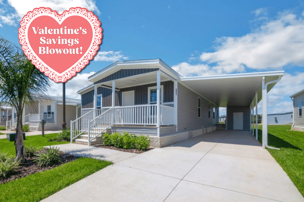 A house with a porch and a driveway.